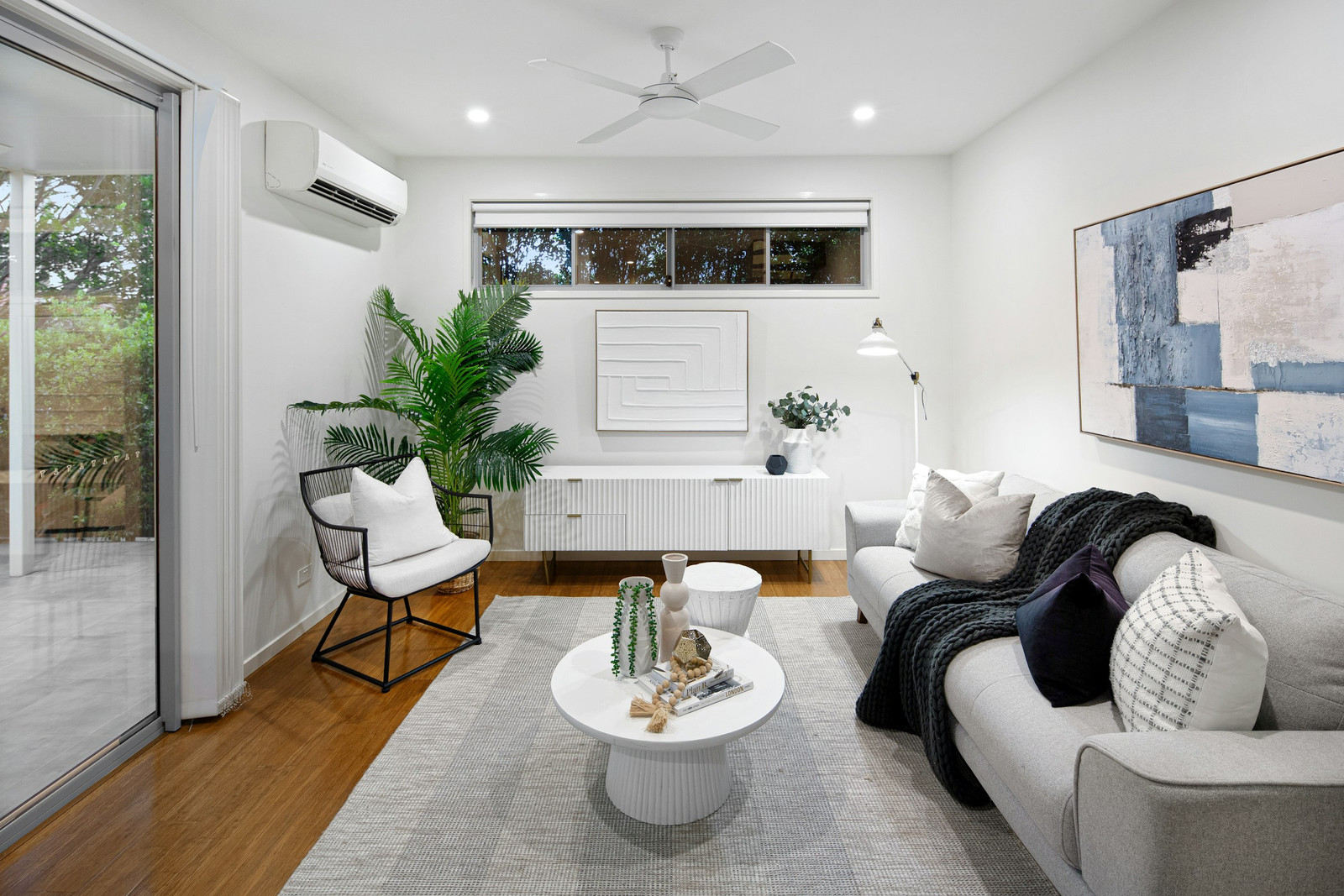 Illustration: A bright living room cooled by a wall-mounted mini-split